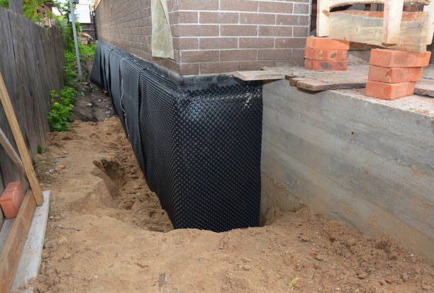 Happy homeowners after waterproofing job in Brookston